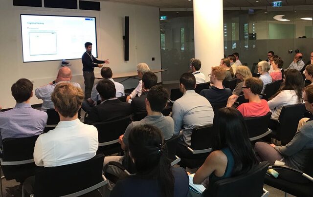 Pablo presenting AI applications to a full room at Deutsche Bank headquarters